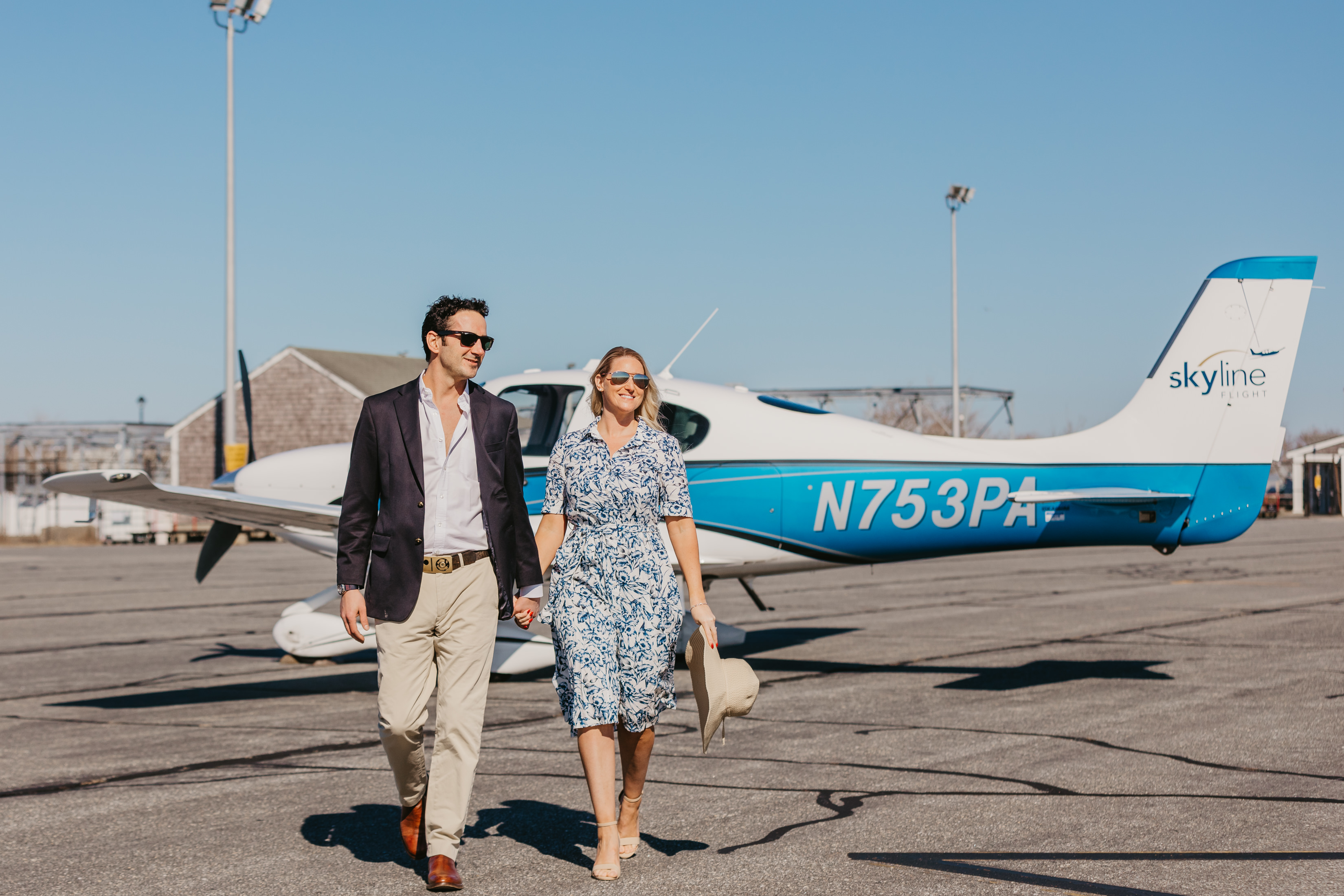 Couple walking from Skyline Flight aircraft