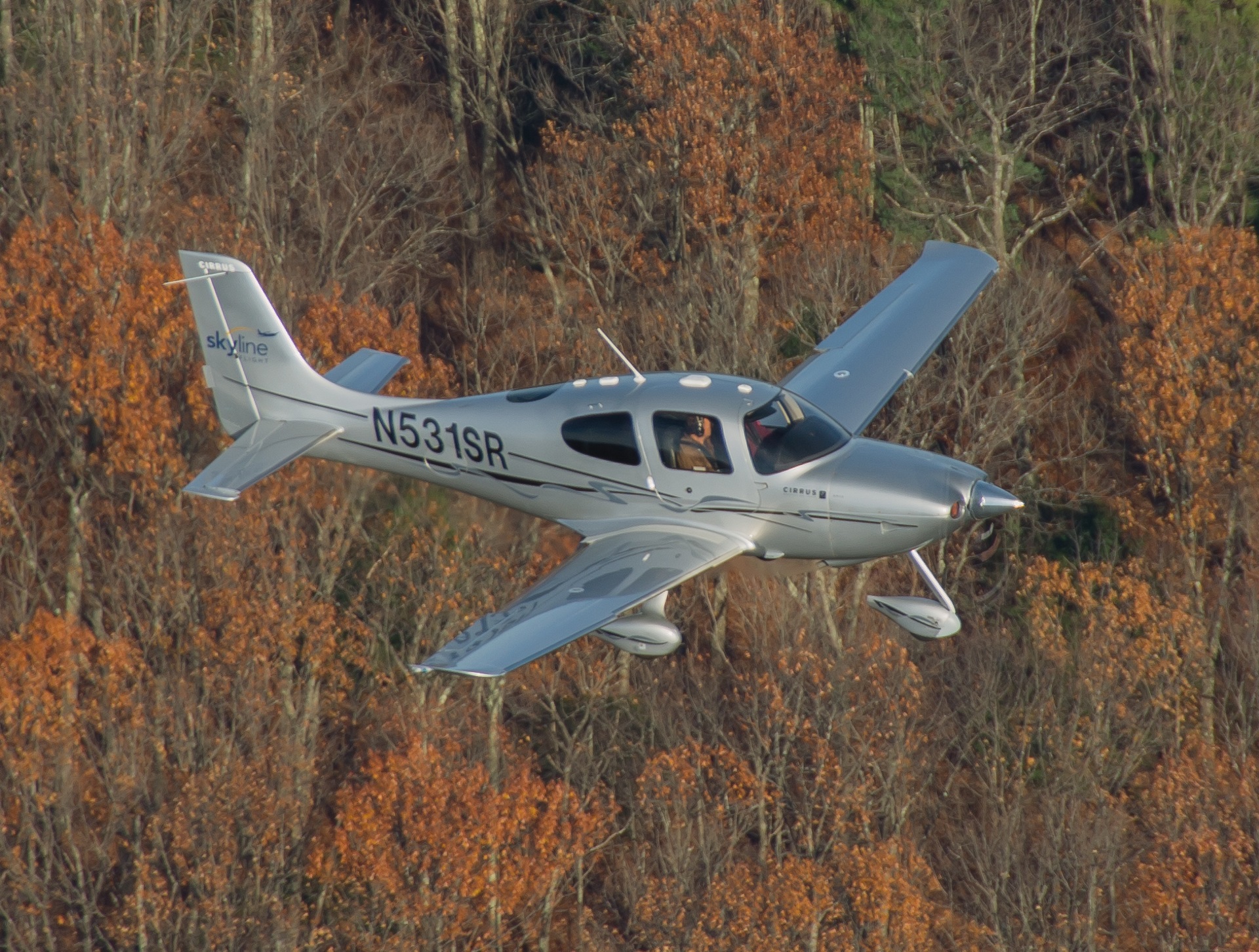 N531SR Skyline Flight SR22 in flight over autumn foliage
